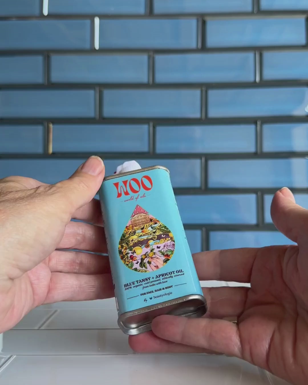 Video of a woman using the Blue Tansy & Apricot Oil from WOO 