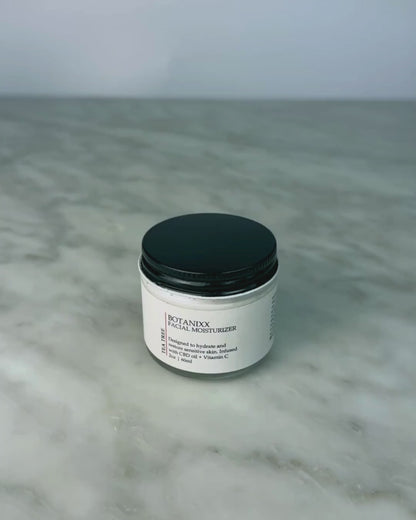 Woman opening jar of Tea Tree + Vitamin C Face Cream