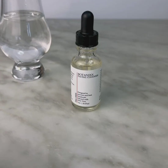 Woman demonstrating using the Tea Tree Face Cleanser with water