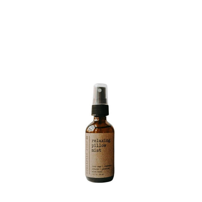 Lavender & Chamomile Pillow Spray for an evening ritual in a brown bottle on white background