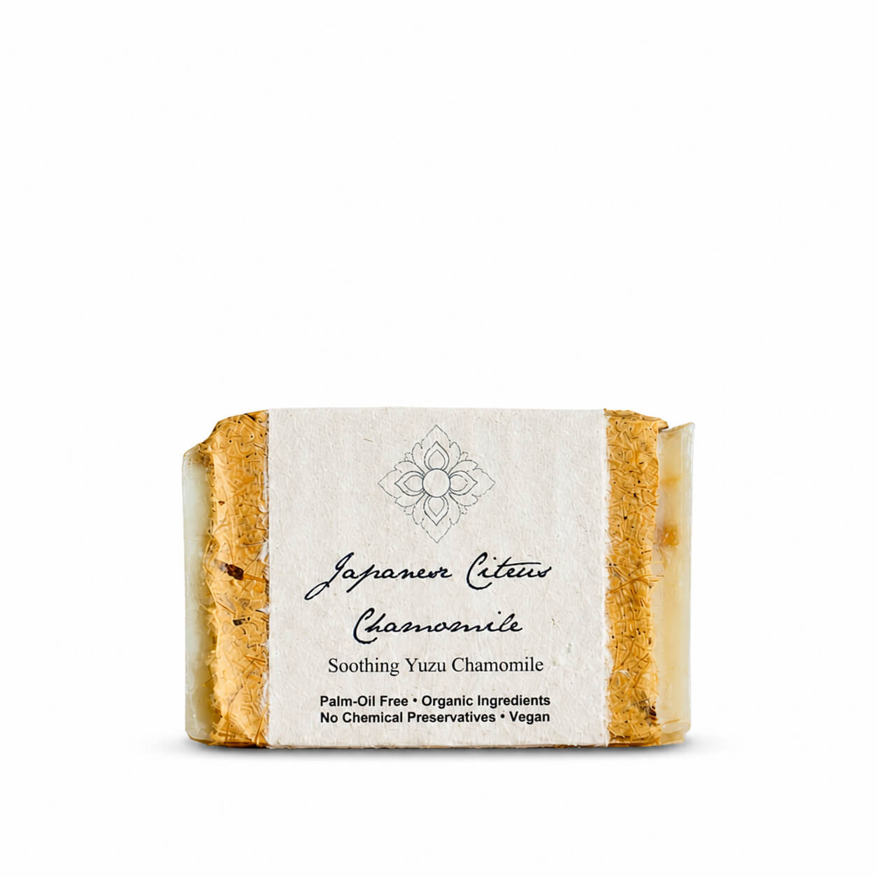 Bar of Japanese Citrus Chamomile soap with a label on a white background