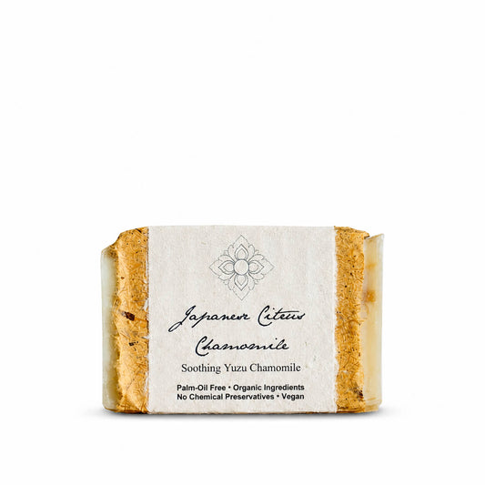 Bar of Japanese Citrus Chamomile soap with a label on a white background