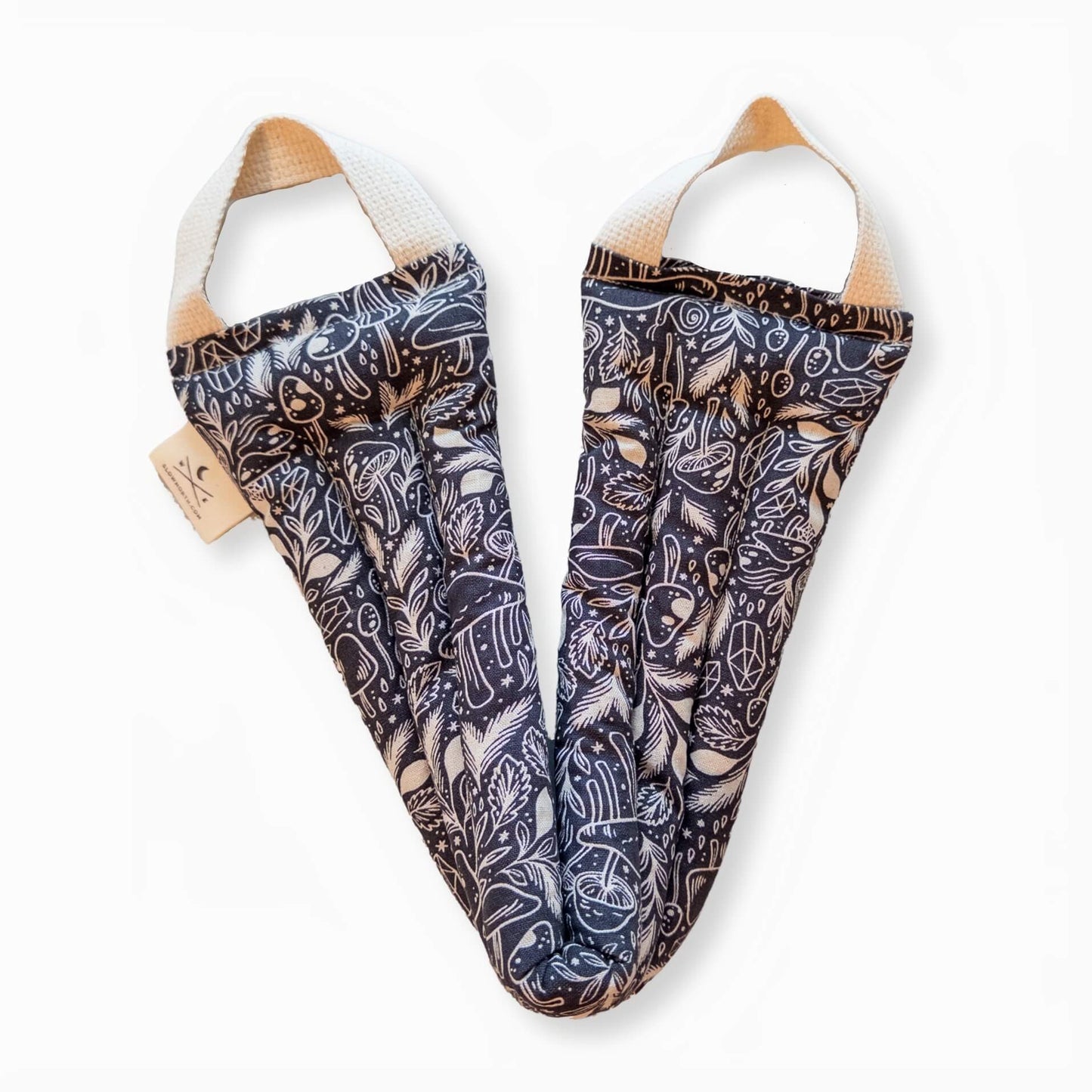 Weighted neck wrap with mushroom pattern unboxed and open on a white background