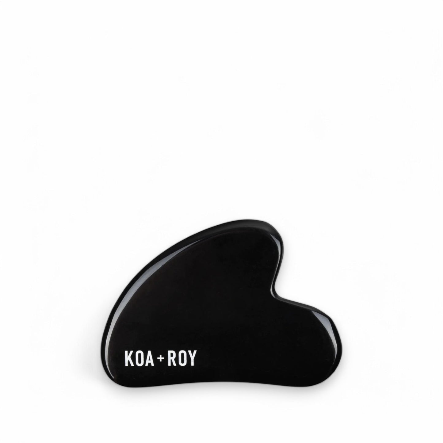 Stone gua sha tool for face on white background