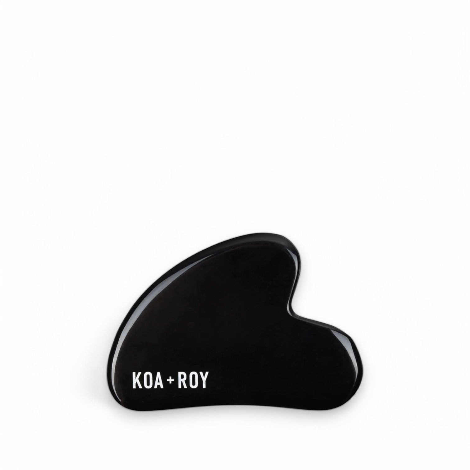 Stone gua sha tool for face on white background