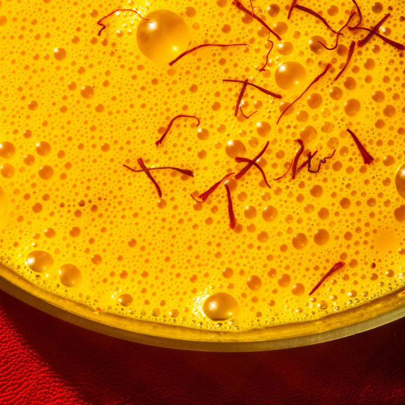 Close up of a prepared saffron latte 