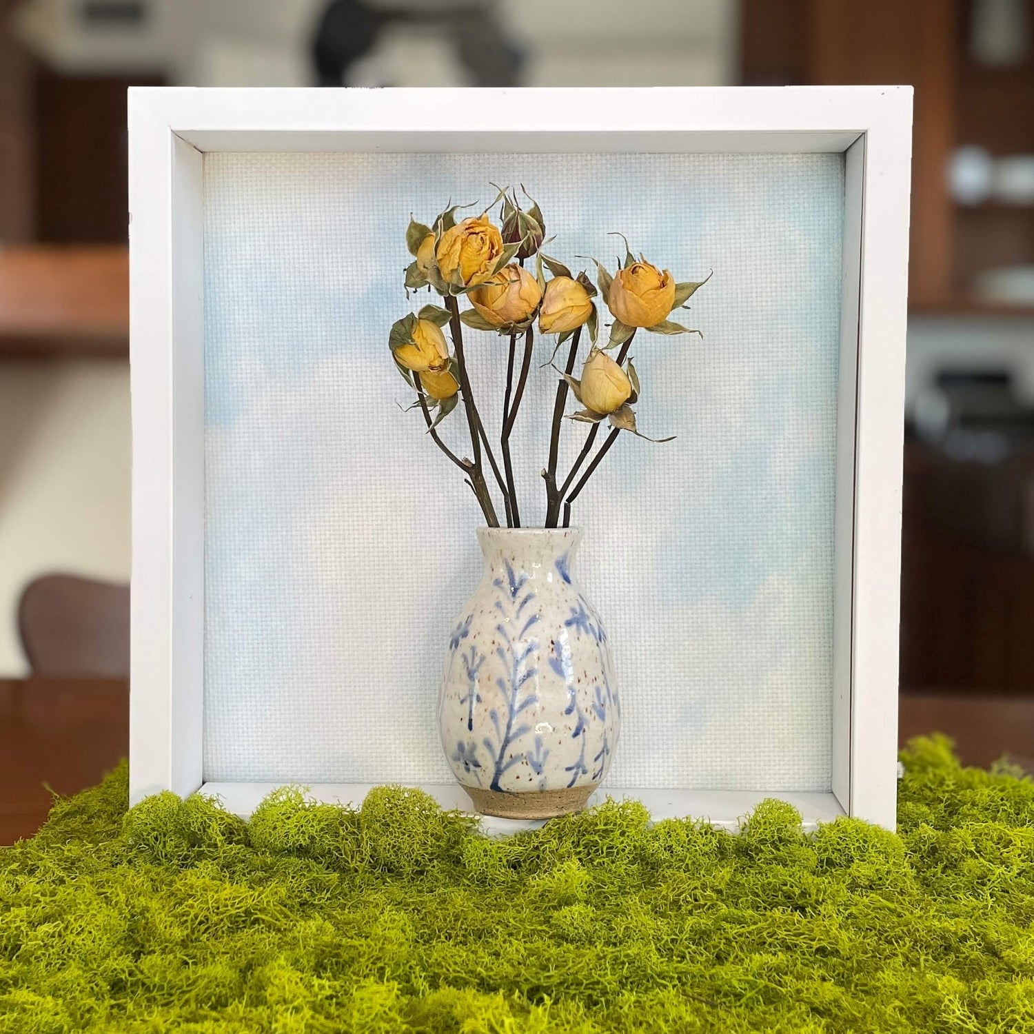 Blue Wildflower Bud Vase with dried yellow roses in a picture box