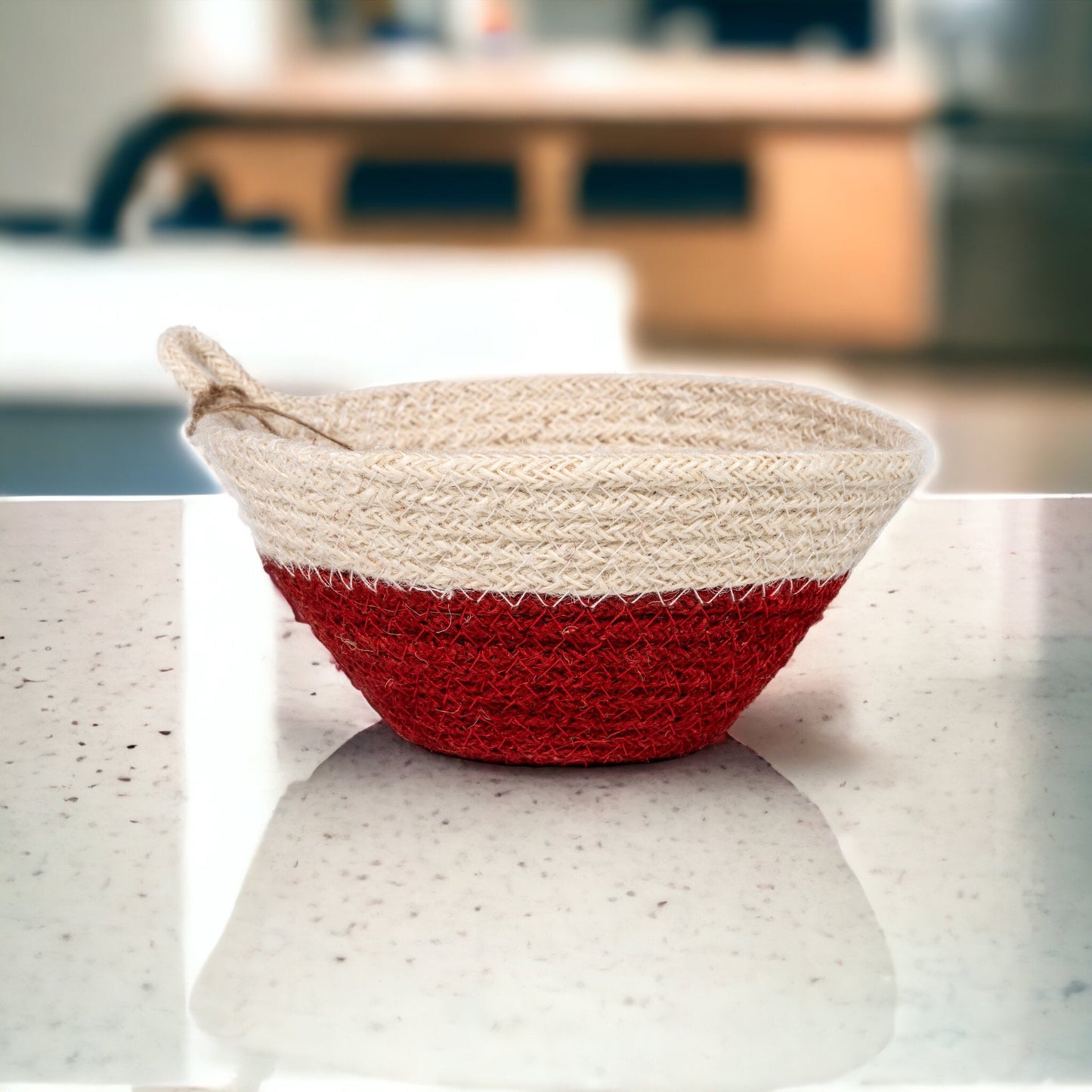 Red and Woven jute red and white basket on white marble kitchen counter