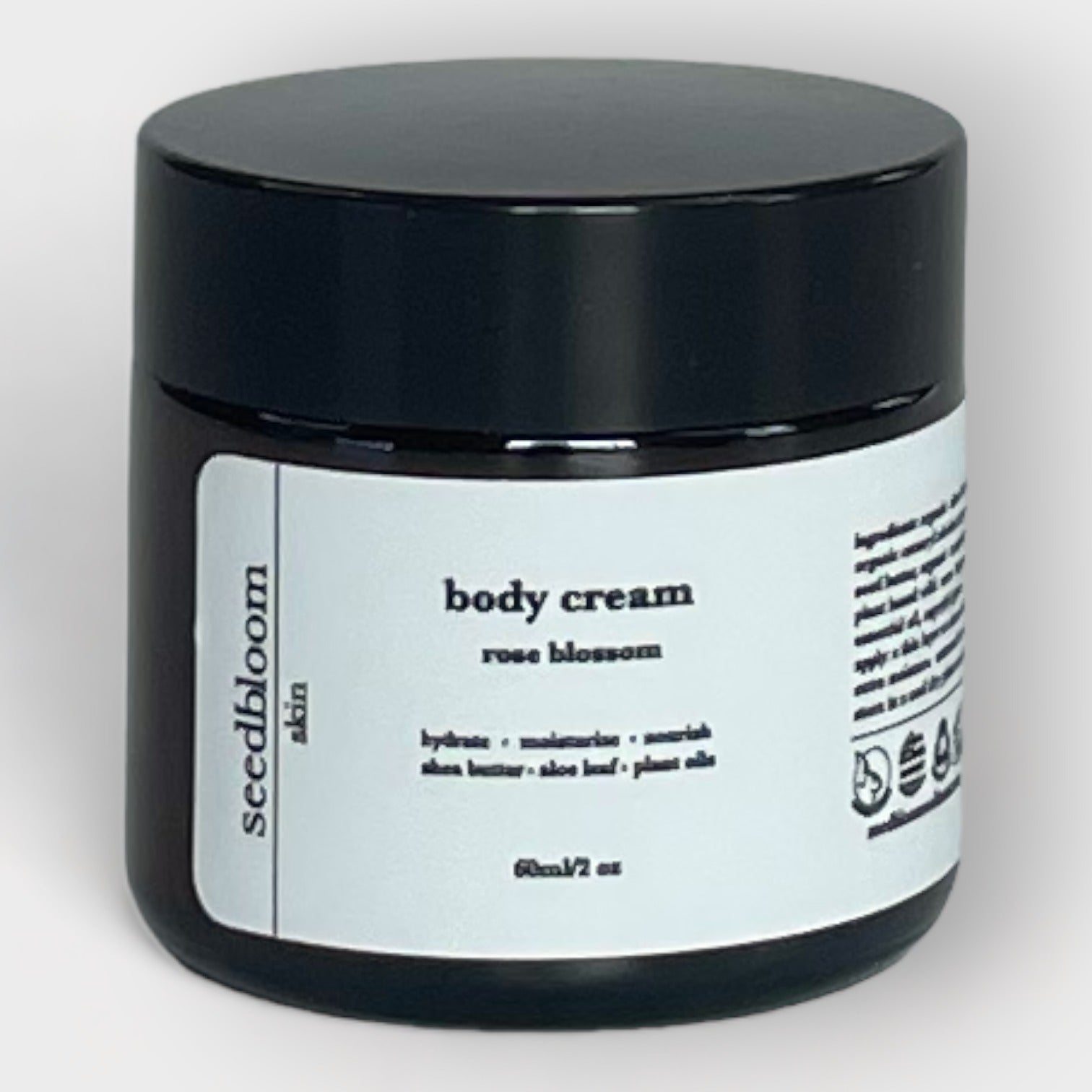Jar of seedbloom body cream on white background